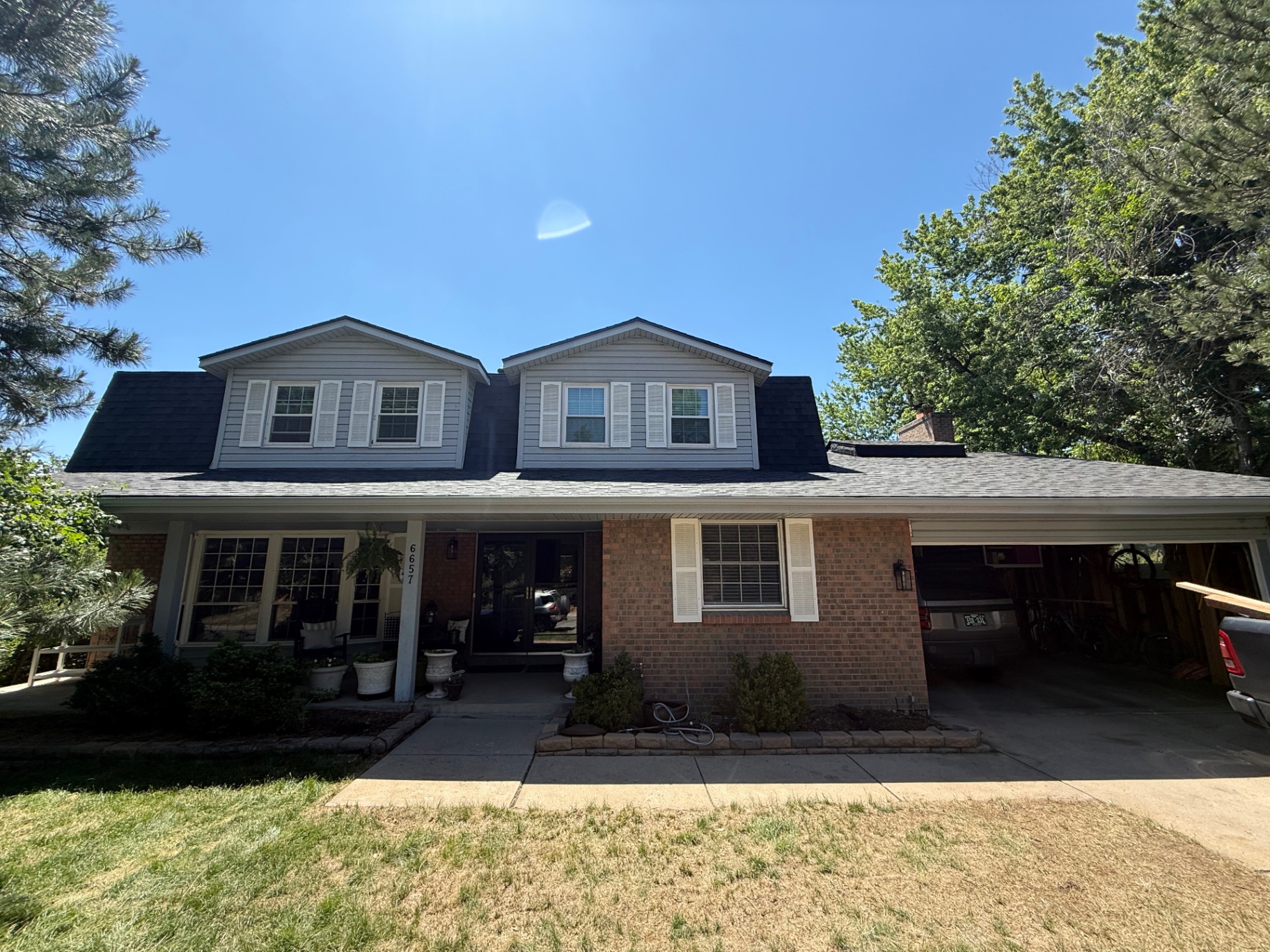Front exterior of Centennial home with new roof completed