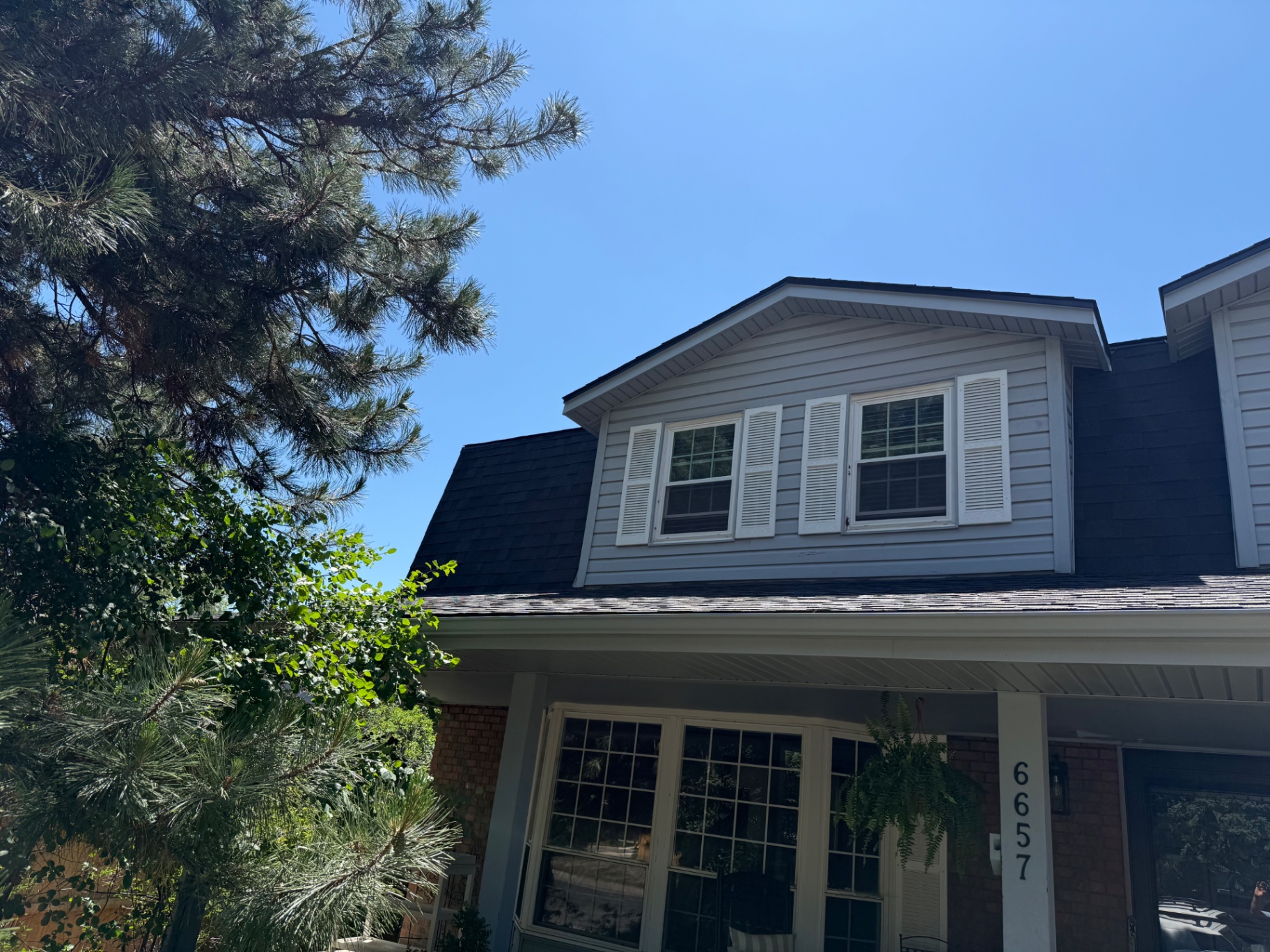 Close-up of new roof and dormer on Centennial home after replacement