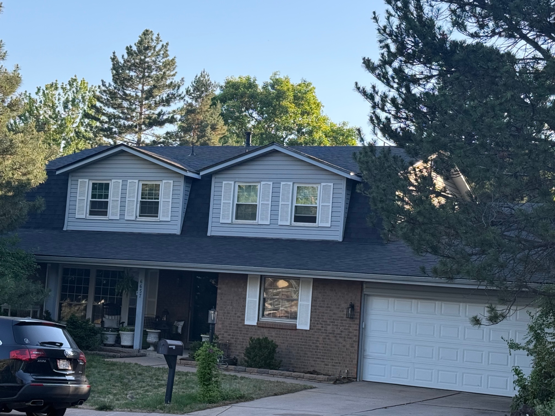 New roof on Centennial home after replacement, side view